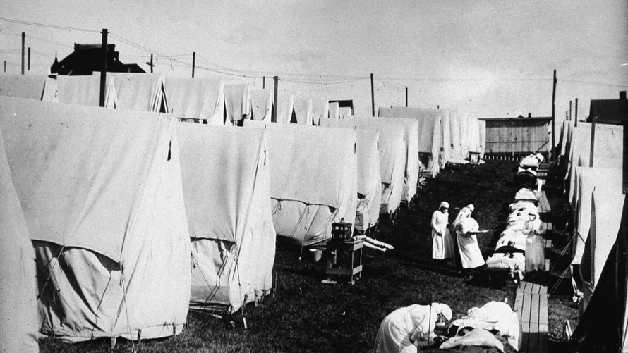 Nurses care for victims of a Spanish influenza epidemic.