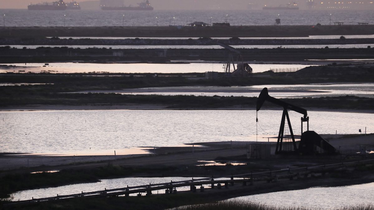 Oil pump jacks stand at the Huntington Beach Oil Fields in California.
